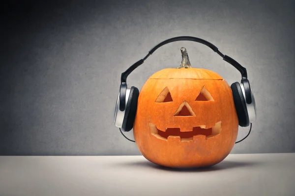 Pumpkin listening to the music — Stock Photo, Image