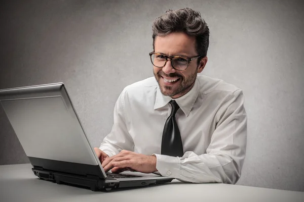 Smiling businessman working — Stock Photo, Image