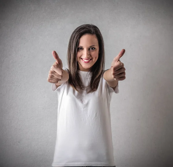 Young woman with her thumb up — Stock Photo, Image