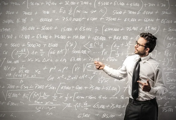 Businessman calculating Stock Picture