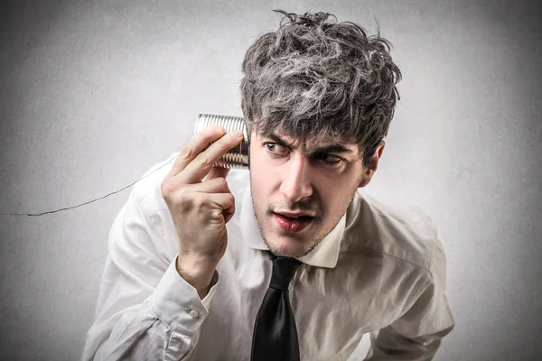 Businessman listening to something — Stock Photo, Image