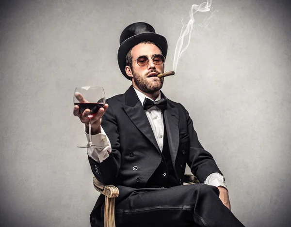 Rich man smoking a cigar — Stock Photo, Image