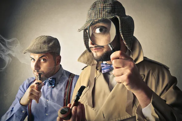 Men acting as detectives — Stock Photo, Image