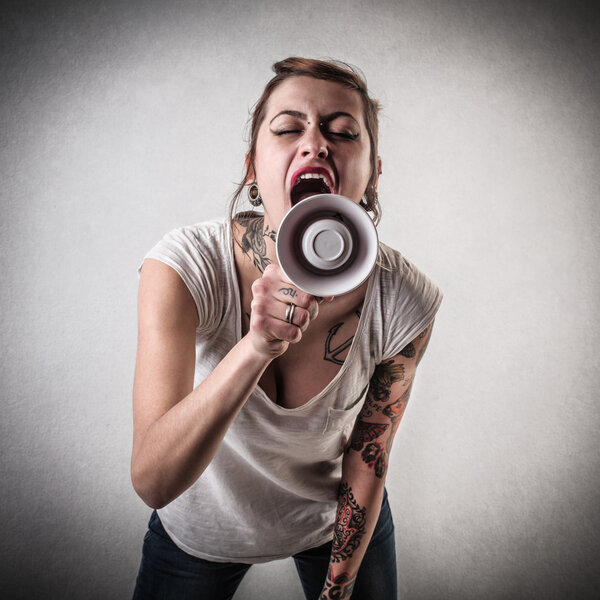 Alternative woman speaking through a megaphone