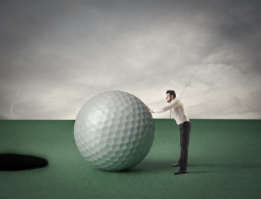 golf topu ile küçük iş adamı
