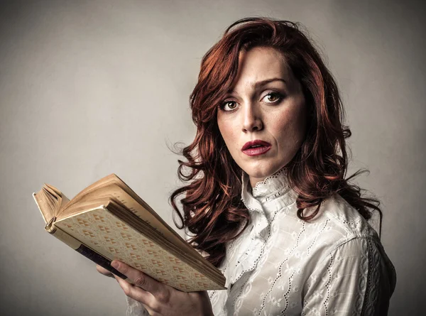 Woman holding a book — Stock Photo, Image