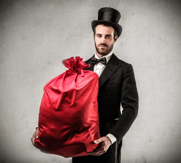 Handsome man holding a present — Stock Photo, Image