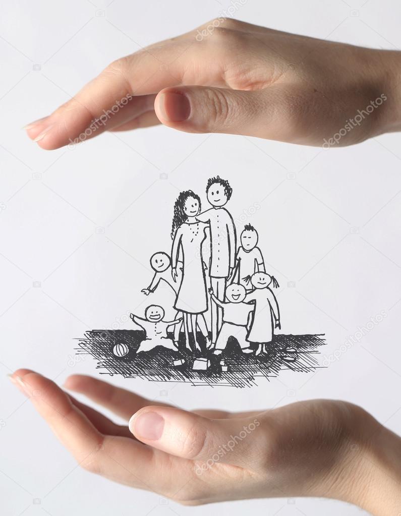 Hands protecting a family