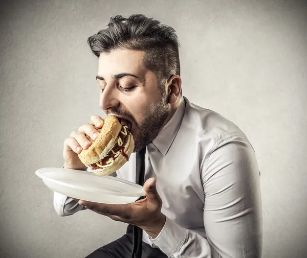 Affärsman under sin lunchrast Stockfoto