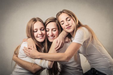 Smiling women hugging clipart