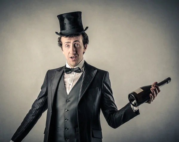 Smart elegant man with a bottle of champagne — Stock Photo, Image