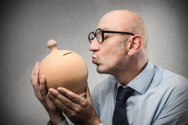 Businessman with a moneybox — Stock Photo, Image