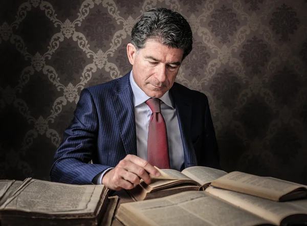 Handsome man reading a book — Stock Photo, Image