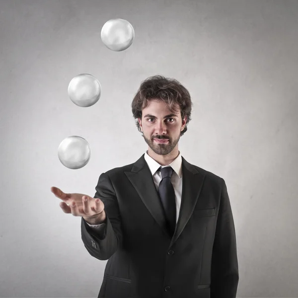 Empresario vomitando algunas bolas de cristal — Foto de Stock