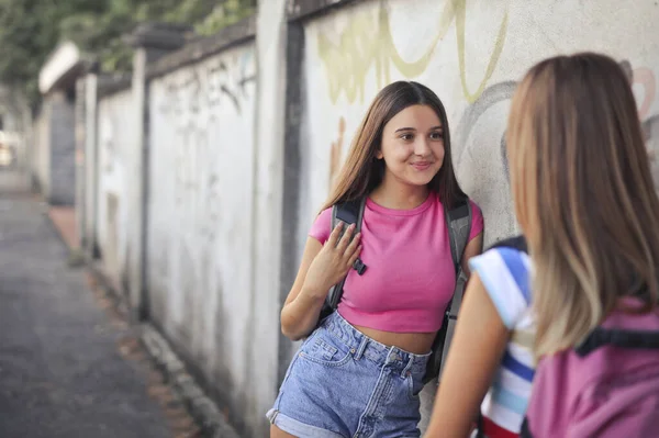 Portrait Two Young Girls Leaning Wall Graffiti — Stock Photo, Image