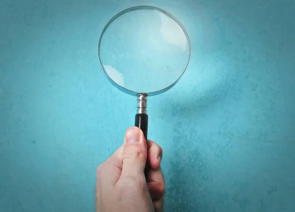 Magnifying Glass Held Blue Background — Foto de Stock