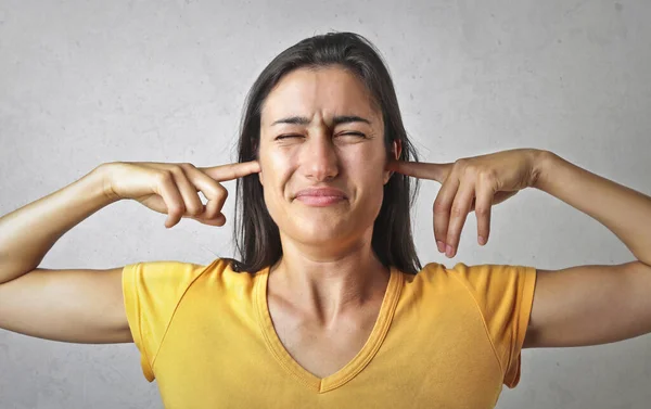 Young Woman Plugs Her Ears Her Fingers — Photo