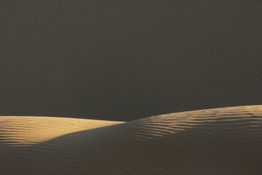 Sand pattern with deep shadows in the Sahara desert of Morocco. clipart