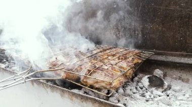 Lamb, mutton, sheep meat on a grill in a street restaurant in Morocco. Traditional food during the Islamic festivals of eid al-Fitr, eid al-Adha, eid el-Kebir. 4k footage.