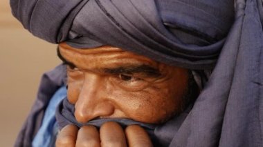 Portrait of a Moroccan man wearing a turban. Authentic Bedouin of South Morocco. 4k.