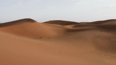 Beautiful serene desert sand dunes landscapes in the Sahara desert, Mhamid, Erg Chigaga, Morocco. Panning, 4k. 