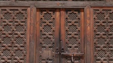 Fez, Morocco - July 24, 2022: Interior architecture of the Madrasa (medersa) Bou Inania, a koranic school, with mosque, in the Medina of Fez (Fes), Morocco. Landmark and important travel destination of Fes. 4k footage.