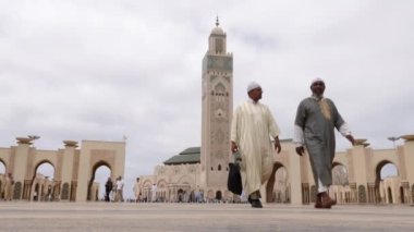 Casablanca, Morocco - July 29, 2022: Moslems come out of the Mosque Hassan II after the Friday prayer. 4k footage 