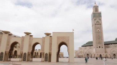 Casablanca, Morocco - July 29, 2022: Moslems come out of the Mosque Hassan II after the Friday prayer. 4k footage