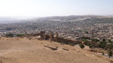 View of the old town of Fez (Fes), Fes el Bali and Fes el Jdid, Morocco. Famous touristic travel destination and UNESCO World Heritage site. 4k, establishing shot.