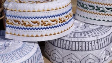 Beautiful embroidered Muslim caps (Taqiyah). Traditional religious headpiece, prayer cap. 4k footage.