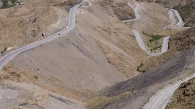 Panoramic view of the winding roads streets of the col of Tizi n'Tichka, High Atlas Mountains, Morocco. Newly repaired and widened road. 4k footage. 