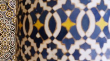 Moroccan zellige mosaic pattern in traditional Islamic geometric design in Morocco. Made with natural colors from indigo, saffron, mint, kohl. 4k Moroccan design background footage.  