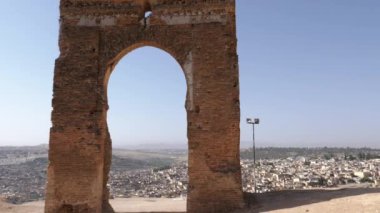 The Marinid tombs (or Merenid) overlooking the Medina of Fez (Fes), Morocco. Landmark, important travel destination, and touristic site of Fes. 4k footage.