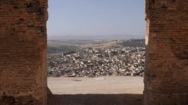 The Marinid tombs (or Merenid) overlooking the Medina of Fez (Fes), Morocco. Landmark, important travel destination, and touristic site of Fes. 4k footage.