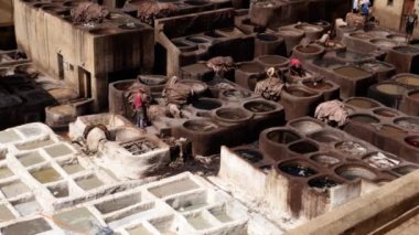 Fes, Morocco - July 24, 2022: Tanneries Chouara in the Medina of Fez in Morocco. Popular touristic travel destination and UNESCO World Heritage site. 4k footage.