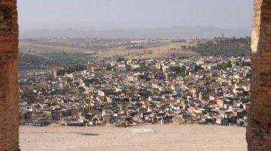 The Marinid tombs (or Merenid) overlooking the Medina of Fez (Fes), Morocco. Landmark, important travel destination, and touristic site of Fes. 4k footage.