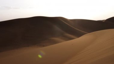 Sahara desert sand dunes landscapes at sunset, Mhamid, Erg Chigaga, Morocco. Nature background 4k footage. 