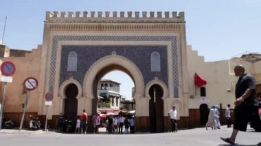 Fez, Morocco - July 23, 2022: Bab Boujloude, door, gate, the entrance of the Medina in Fez (Fes), Morocco. Landmark and iconic touristic site of Fes. 4k footage.