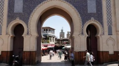 Fez, Morocco - July 23, 2022: Bab Boujloude, door, gate, the entrance of the Medina in Fez (Fes), Morocco. Landmark and iconic touristic site of Fes. 4k footage.