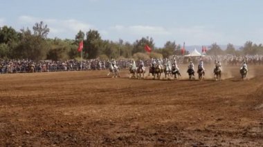 Had Draa, Marrakech, Morocco - June 25, 2022: Fantasia (Tbourida or lab al baroud) Traditional Moroccan Berber Arab Horse Festival. A tradition inscribed for the UNESCO Intangible Cultural Heritage of Humanity list. 4k.