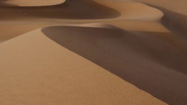 Windy desert sand dunes landscapes in the Sahara desert, Mhamid, Erg Chigaga, Morocco. 4k.