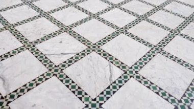 Traditional Moroccan floor with zellige mosaic tiles and marble. Pattern in Islamic geometric design. Marrakech, Morocco. 4k footage. 