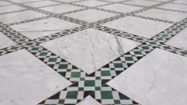 Traditional Moroccan floor with zellige mosaic tiles and marble. Pattern in Islamic geometric design. Marrakech, Morocco. 4k footage. 