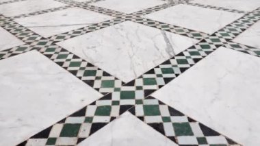 Traditional Moroccan floor with zellige mosaic tiles and marble. Pattern in Islamic geometric design. Marrakech, Morocco. 4k footage. 