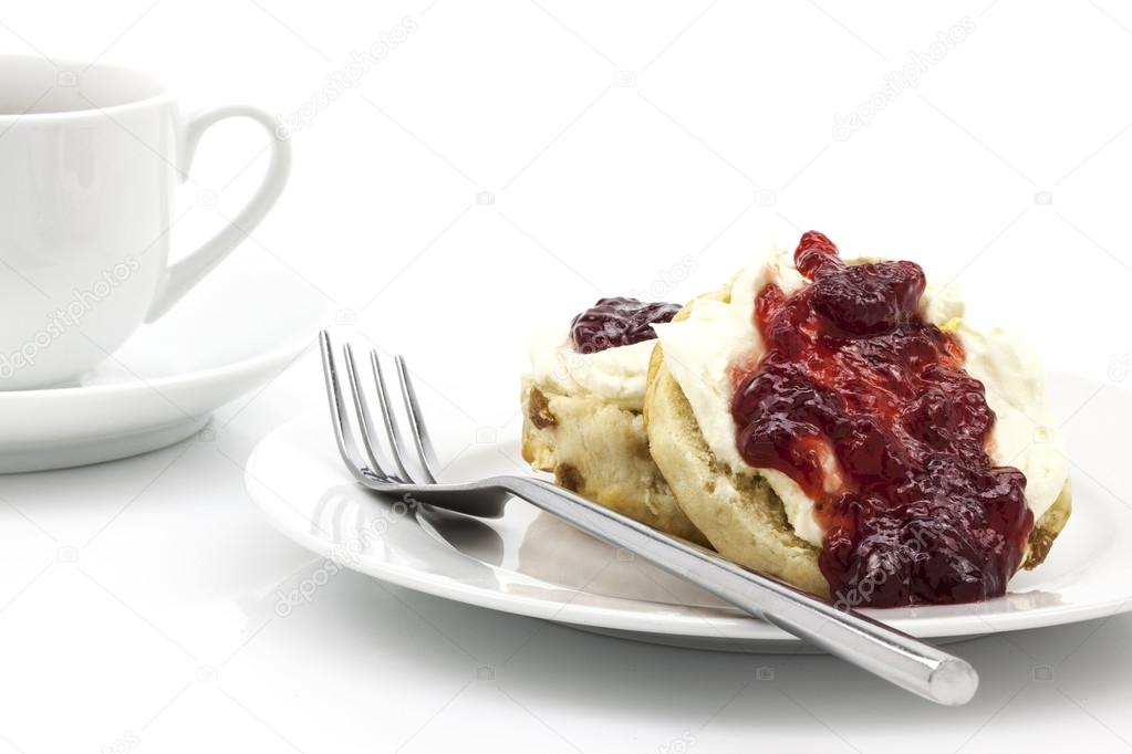 Home-baked scones with strawberry jam and clotted cream, often s