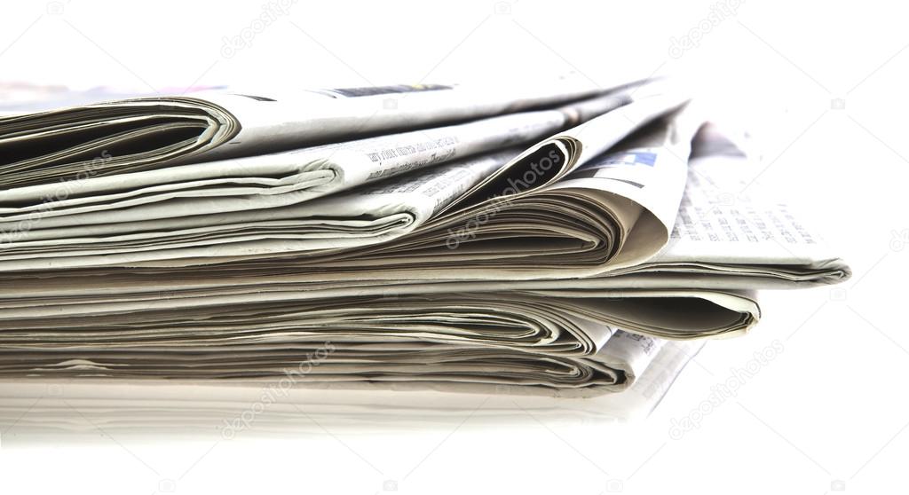 Various newspapers over white background