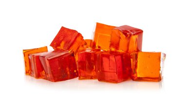 Orange jelly cubes on white background clipart
