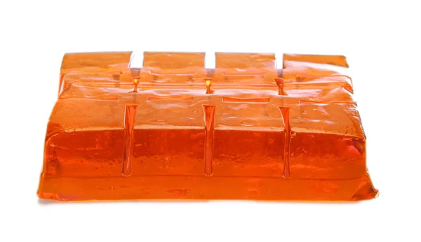 Block of orange jelly cubes on white background — Stock Photo, Image