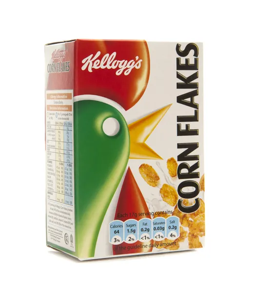 Copos de maíz Kelloggs sobre un fondo blanco — Foto de Stock