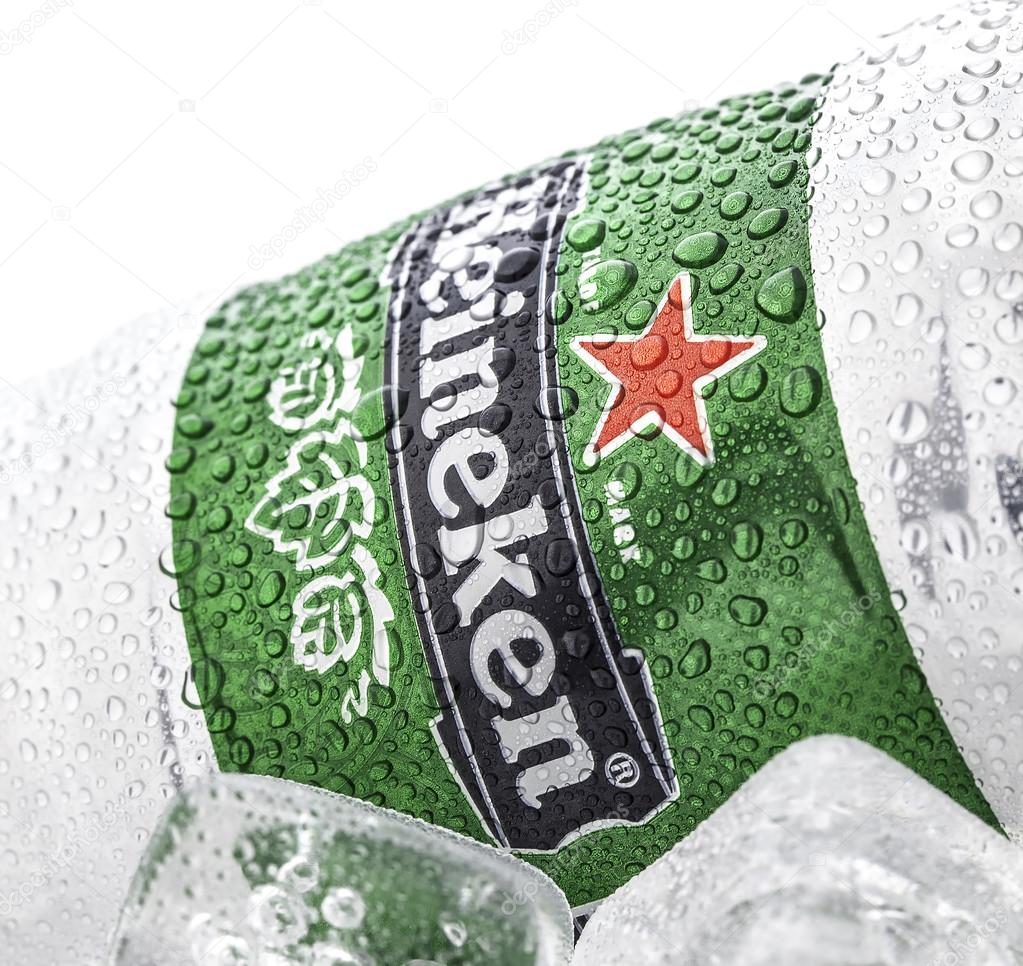 SWINDON, UK - APRIL 6, 2014: Cold can of Heineken Beer on ice overa white background